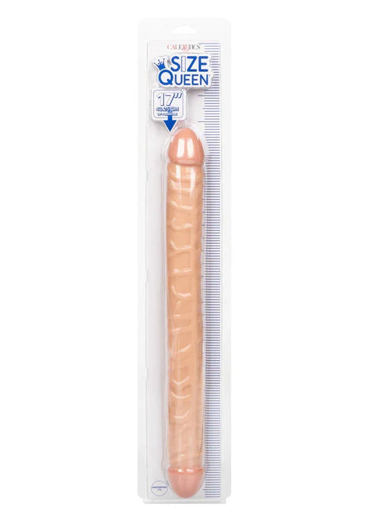 Dubbelzijdige dildo in verpakking, lichtroze met ribbels en ronde kop.