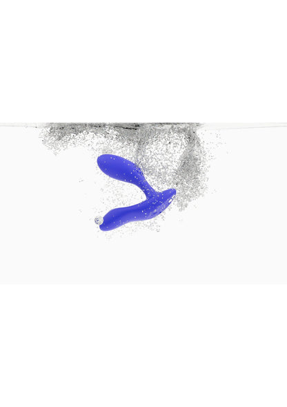 Marineblauwe We-Vibe Vector + vibrerende plug met waterdruppels rond het uiteinde.