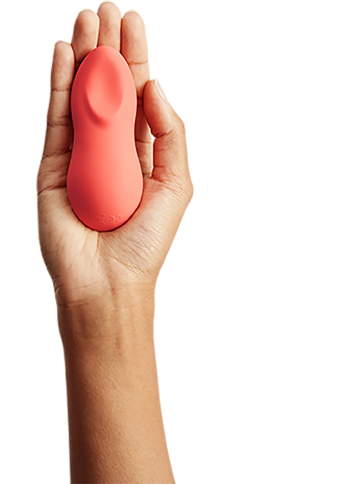 Oranje ovale vibrator in hand, glad en afgerond