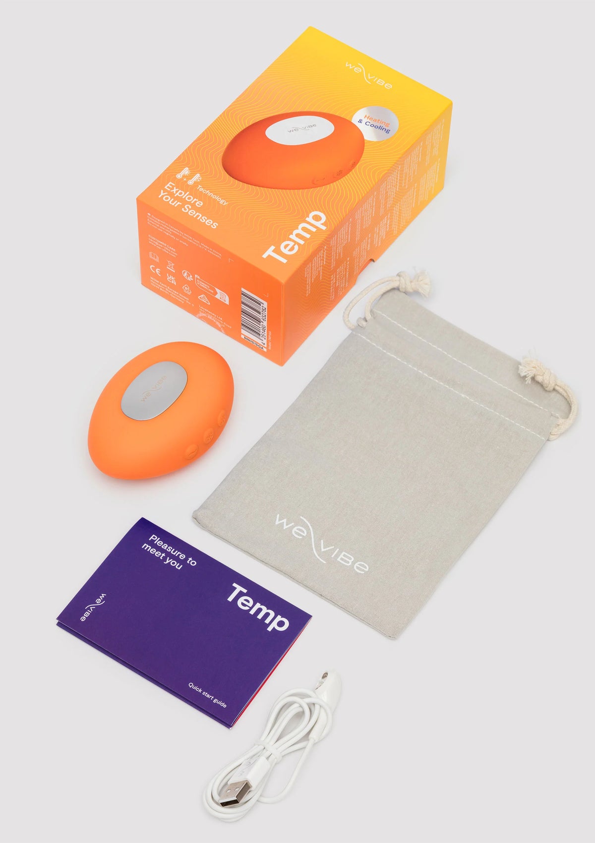 Temp set: oranje massager, doos, handleiding en stoffen opbergtas met kabel