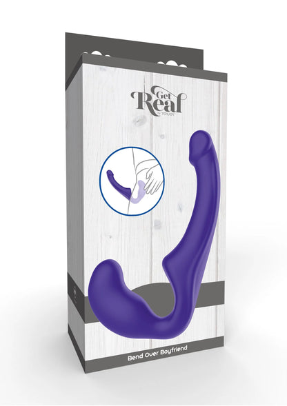 Verpakking met paarse siliconen strap-on in gebogen U-vorm