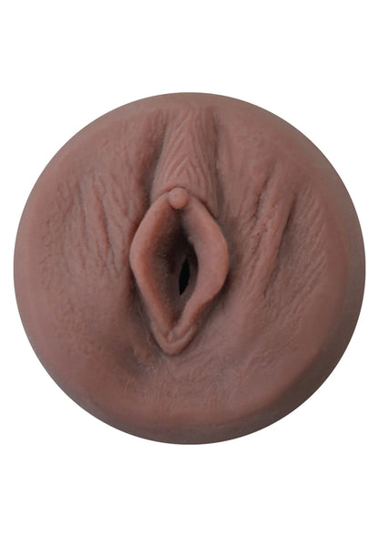 Close-up van bruin uitloopopening in ronde sextoy-behuizing