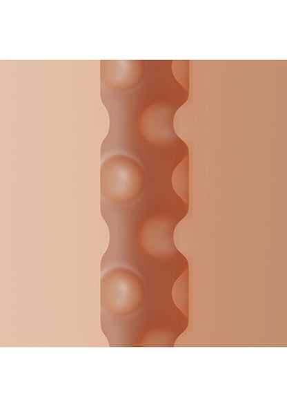 Close-up van bruine binnenwand met rij ronde noppen op het oppervlak