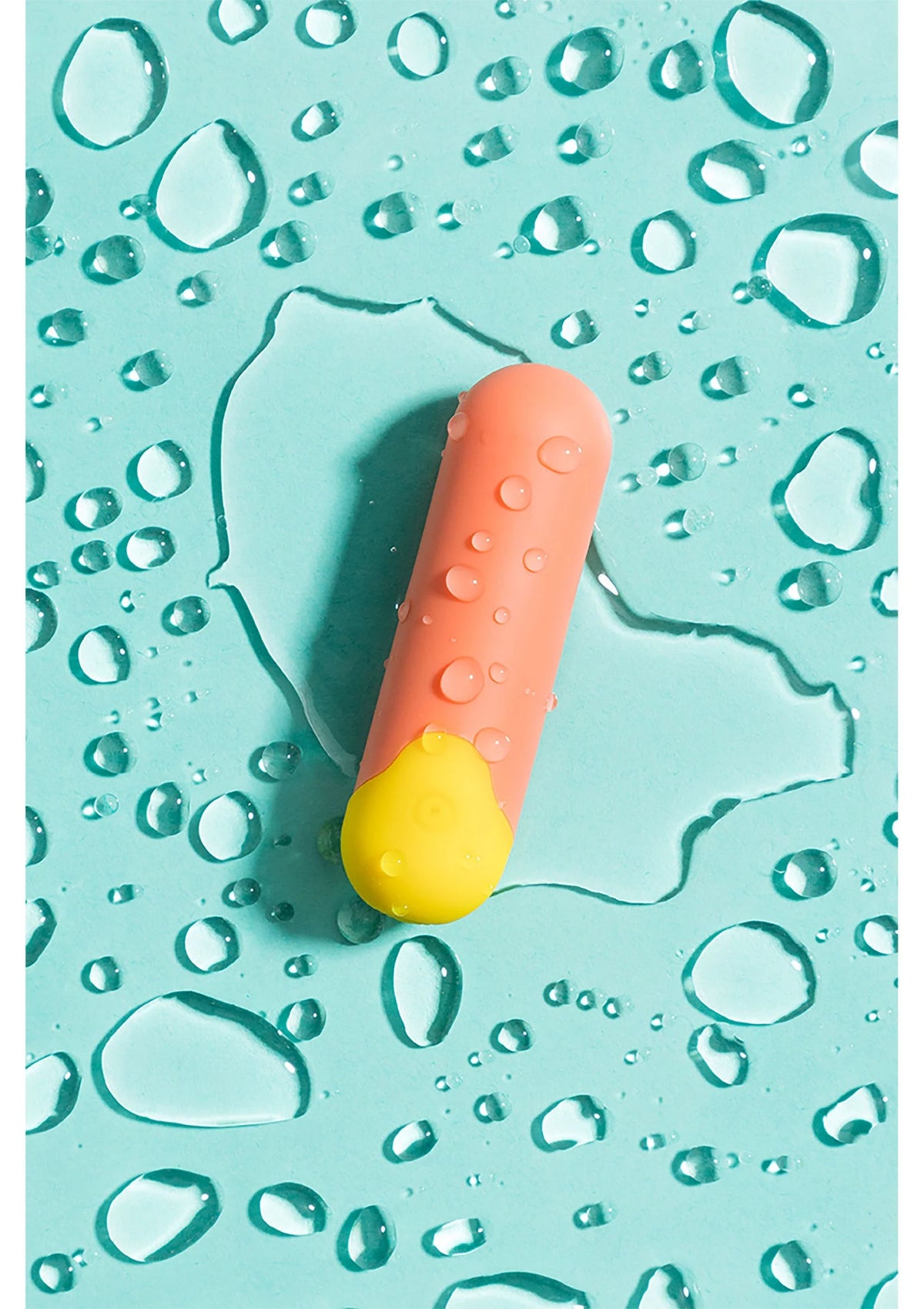 Romp Riot mini vibratortje in water met gele en oranje accent