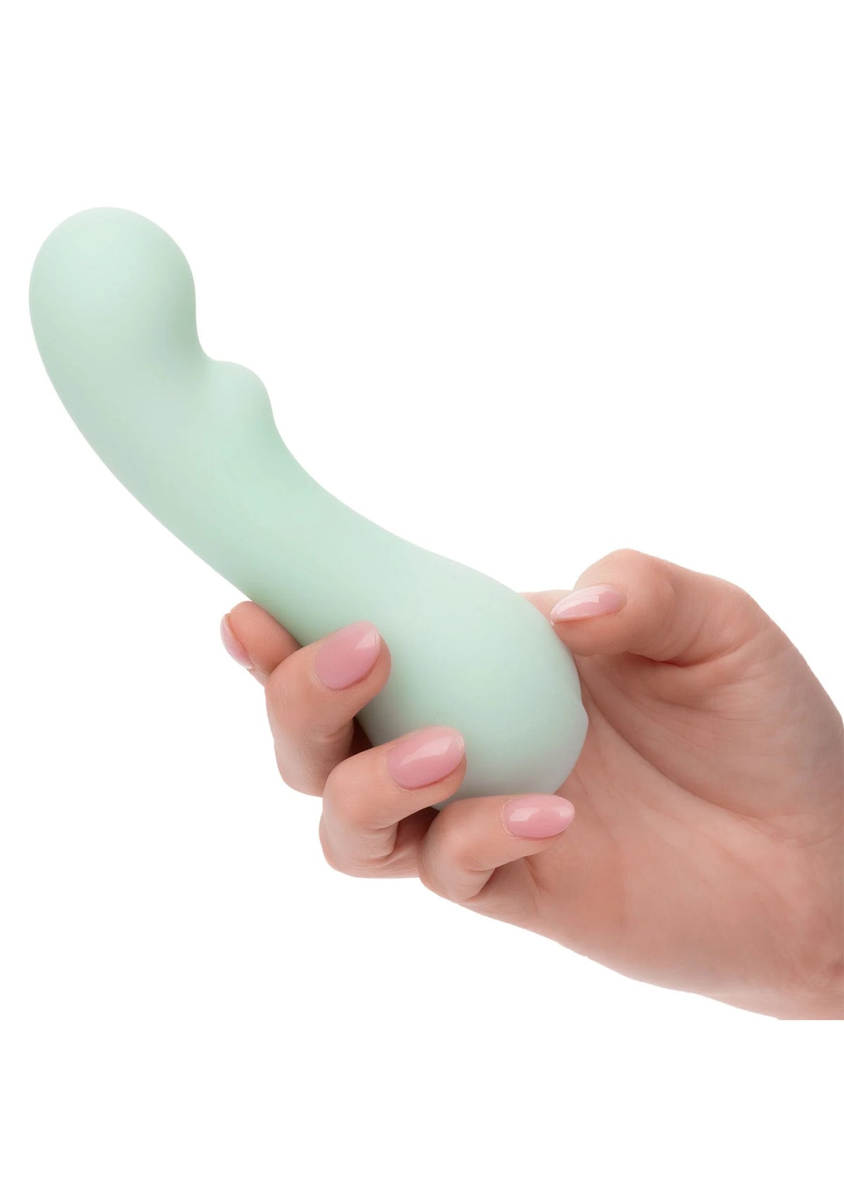 Muntgroene siliconen vibrator vastgehouden in handen, gebogen vorm