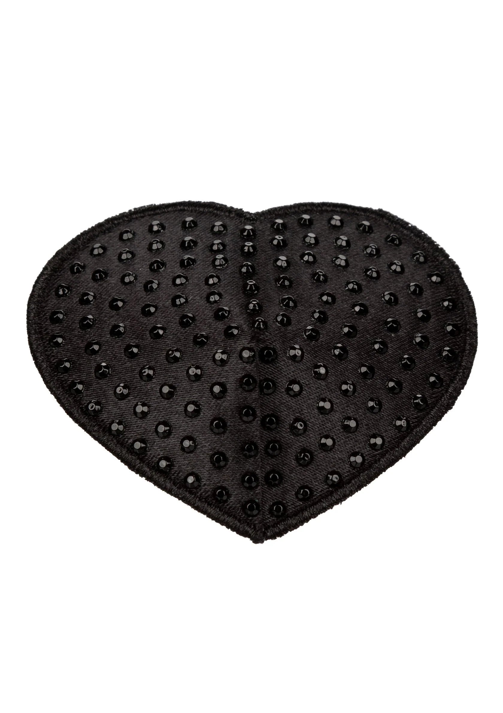 Hartvormige zwarte pasty met kleine noppen, close-up op het hartpatroon