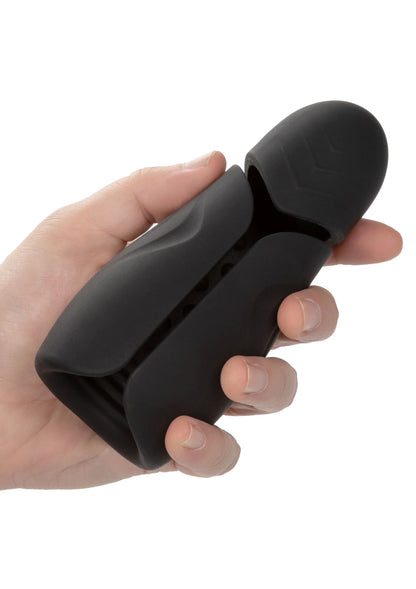 Hand-held power-stroker in zwart vastgehouden in mensenhand