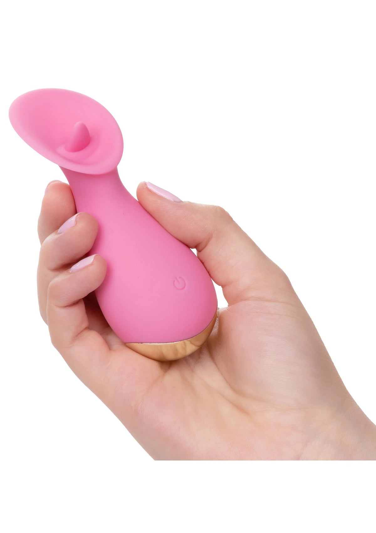 Roze siliconen vibrator in hand vastgehouden met zichtbare flikkertong en knop