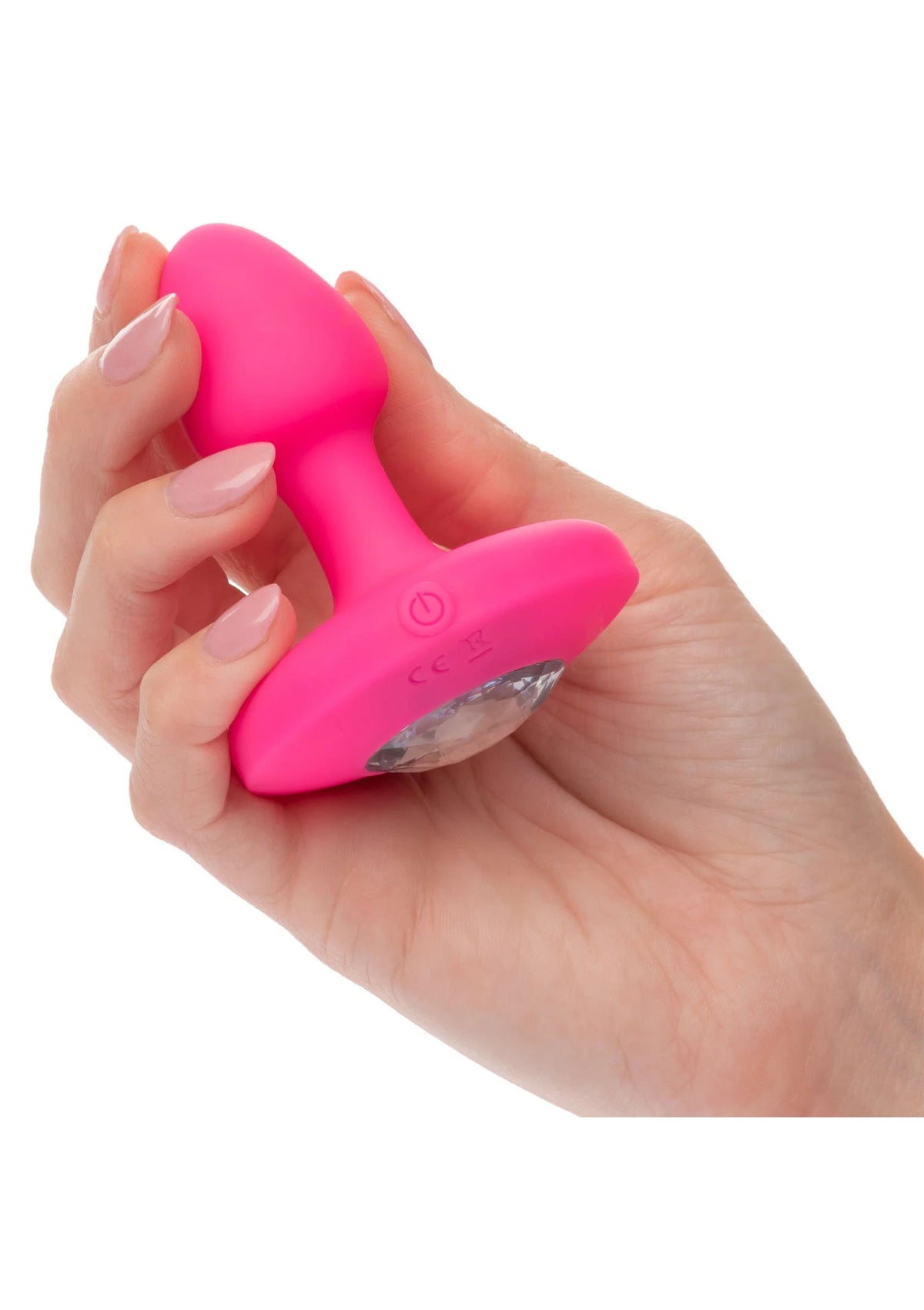 Roze vibrerende probe vastgehouden in hand met kleine bedieningsknop