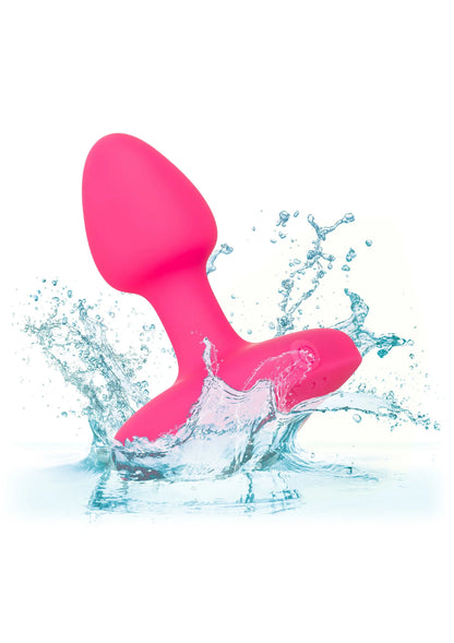 Roze vibrerende probe met waterdruppels rondom de afgeronde basis en top