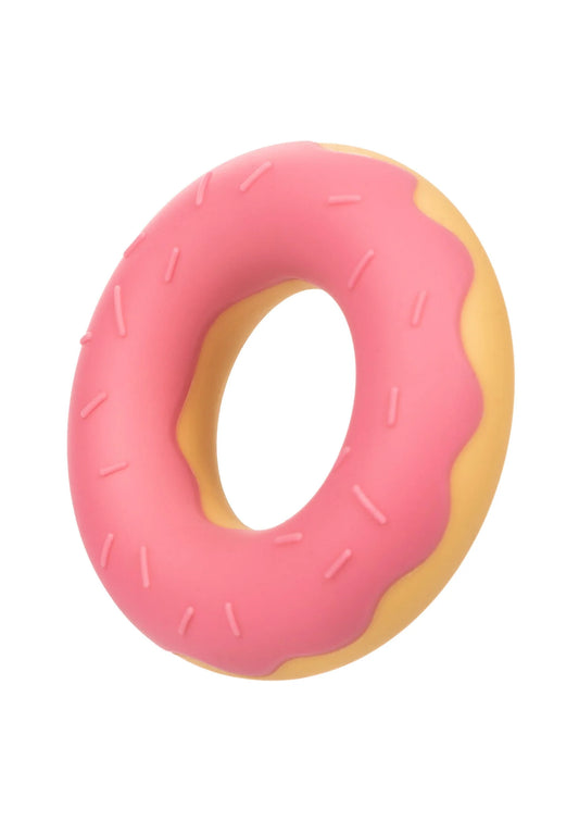 Roze siliconen donut-cockring met gele rand en kleine sprinkles, ronde vorm