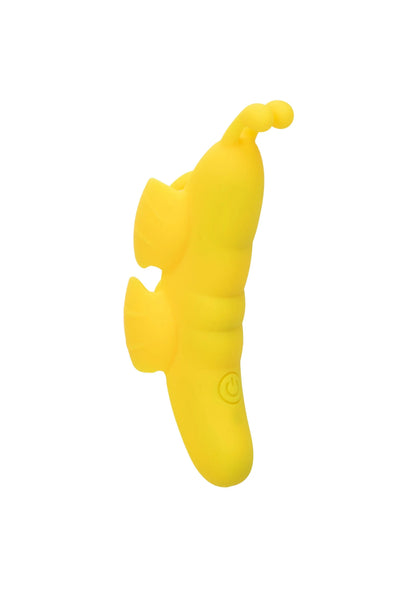 Gele vlinder-vormige vibrator schuin van opzij, met ronde uitsparingen in de buik.