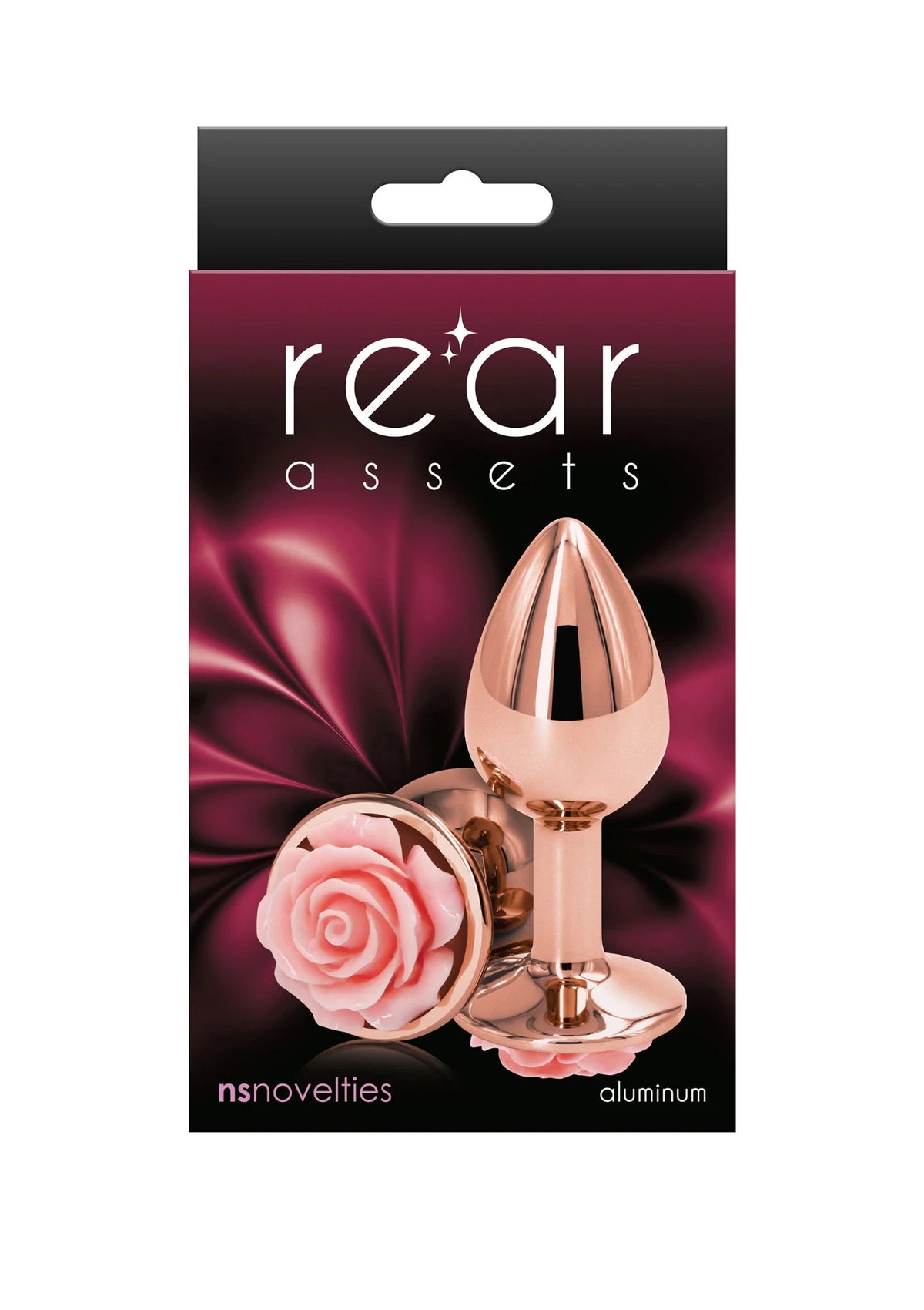 Kleine rozenbuttplug van NS Novelties in verpakking, rose-goudkleurige plug met roze roosbloem