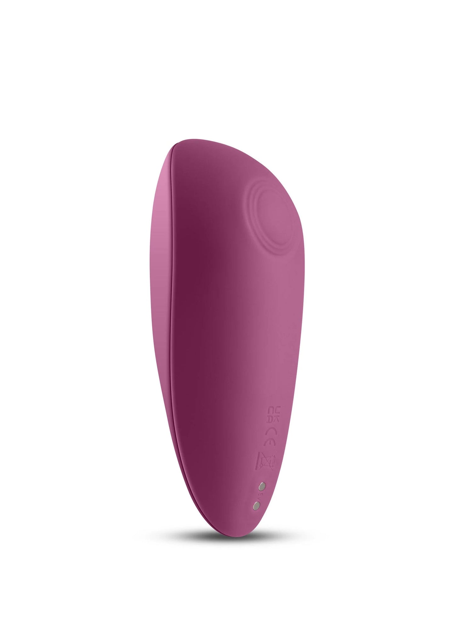 Compacte paarse vibrator, ovale behuizing met kleine puntjes onderaan
