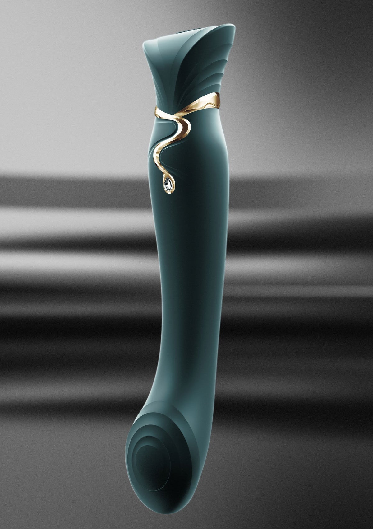 Donkergroene G-spot vibratorspeeltje met gouden ringdetail en ronde onderkant
