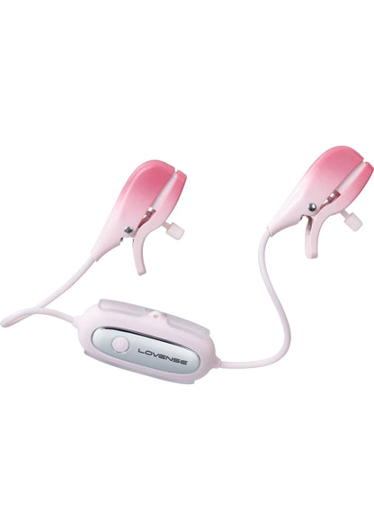 Roze nippelklemmen met bedienunit en twee kabels in diagonale opstelling