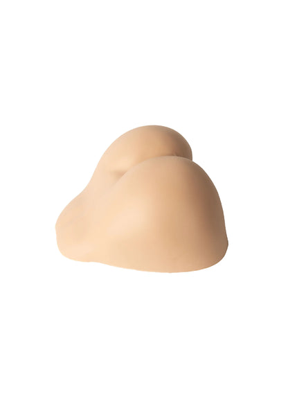 Beige siliconen anale masturbator met afgeronde kontvorm en korte opening