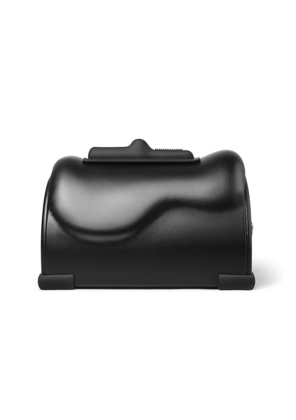 Zwart massageapparaat met opstaande handgreep en afgeronde behuizing