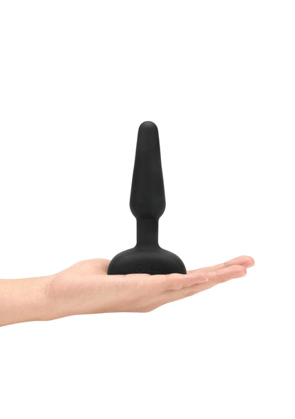 Zwarte anaale plug in hand, conische vorm