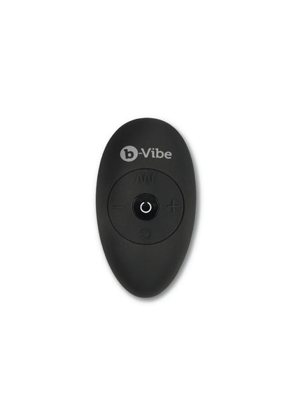 B-Vibe afstandsbediening, ovale zwarte behuizing met aan/uit-knop.