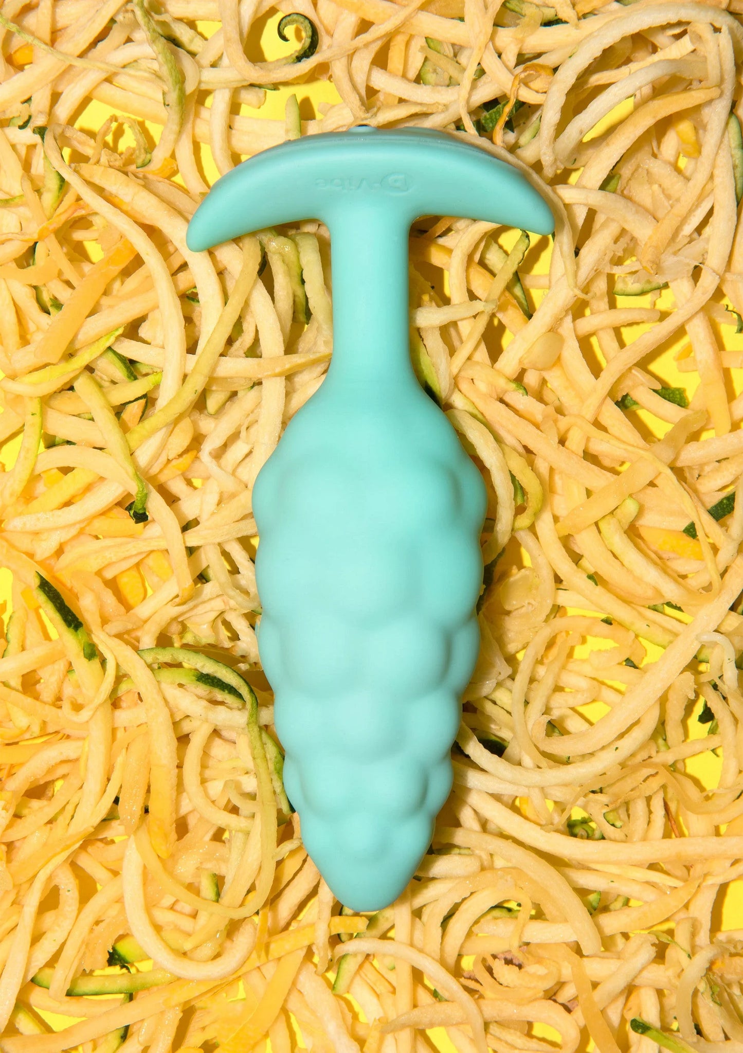 B-Vibe anale plug met bump-textuur, lichtblauwgroene plugvorm