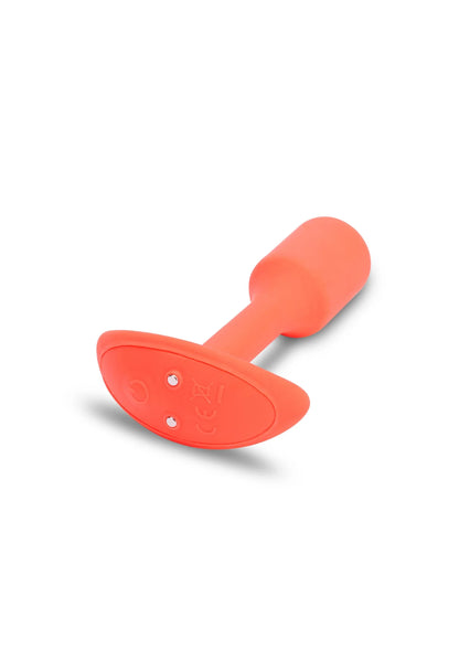 Oranje trilling snug plug van B-Vibe, close-up van brede basis