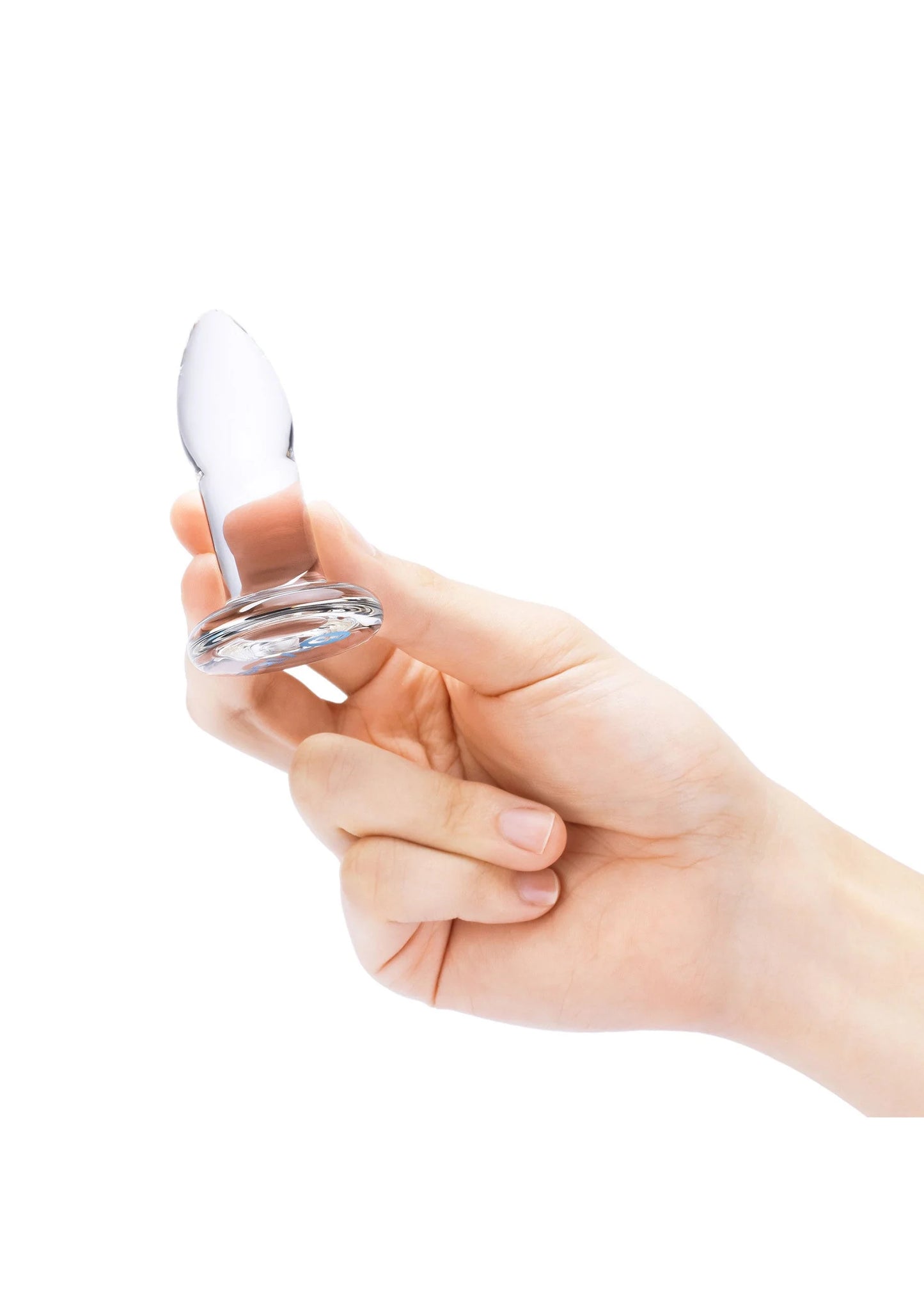 Anale dilator in hand: kegelvormig wit-transparant deel met brede ronde basis