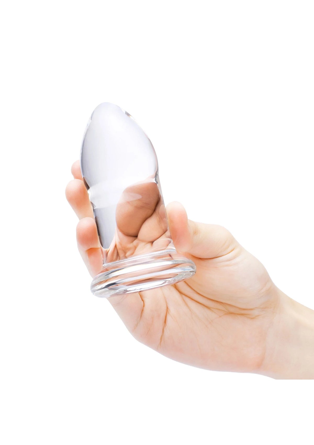 Hand houdt een witte anale dilator vast, kegelvormige punt met transparante voet
