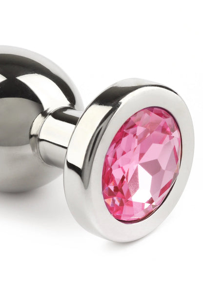 Zilverkleurige buttplug close-up met roze ovale steen in metalen omlijsting