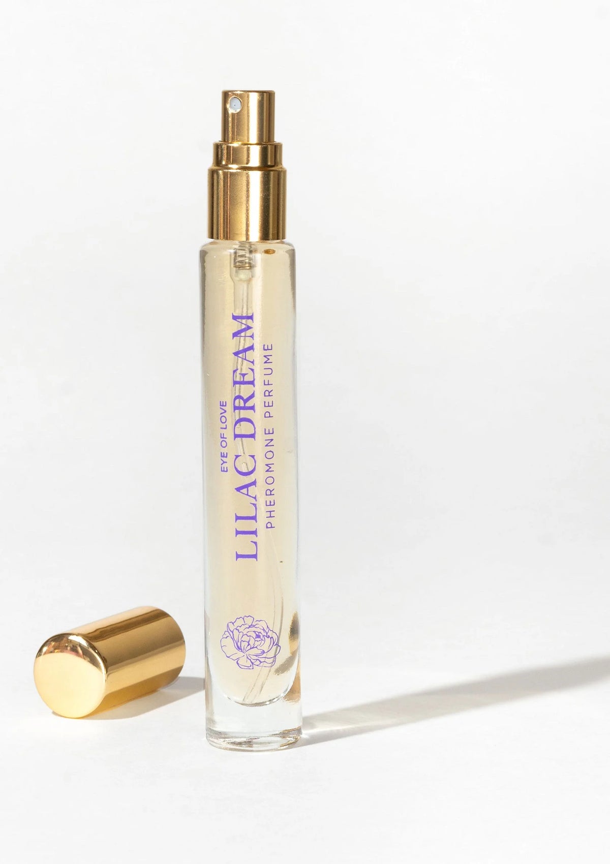 Lilac Dream parfumflesje met gouden sproeiknop, doorzichtige fles.
