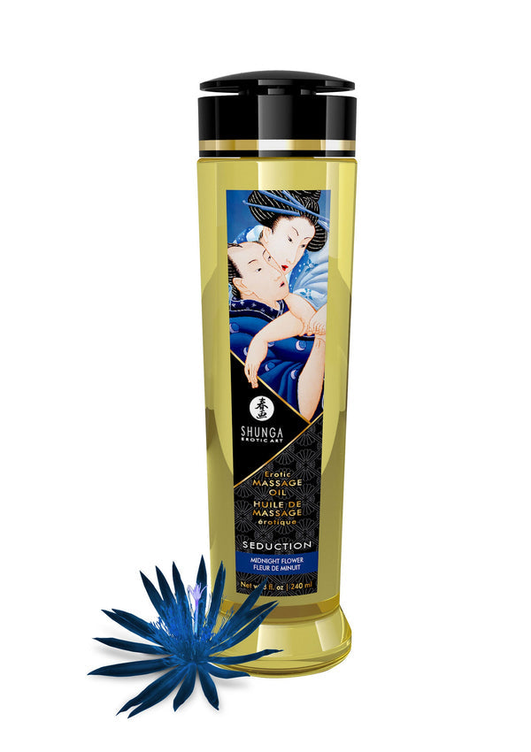 Shunga massageolie in gele fles met zwarte dop en gouden band, met blauwe bloem