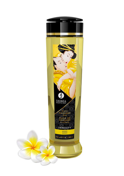 Shunga massageolie in gele fles met zwarte dop en gouden band, met witte bloemen