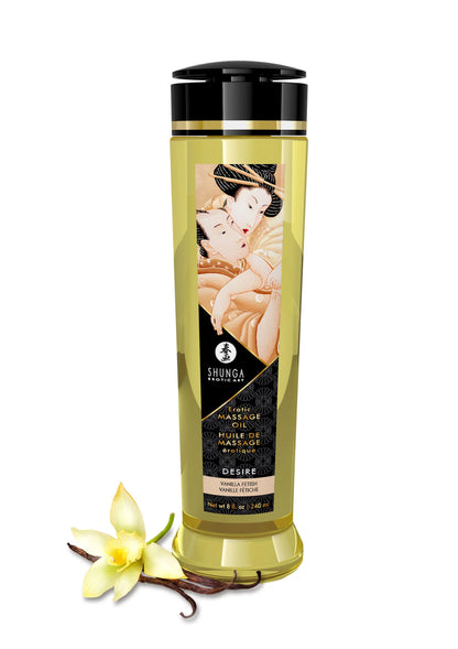Massageolie-fles Shunga met zwarte dop en oranje etiket, met witte bloem en vanillepod.