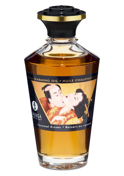 Verwarmende massageolie van Shunga in oranje fles met zwarte schroefdop, 100 ml.
