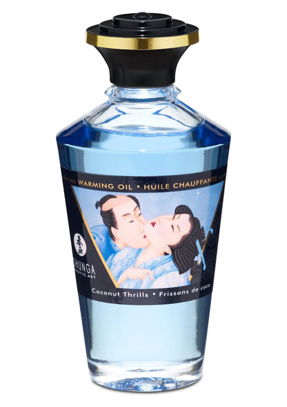 Warming oil fles met zwarte dop en heldere blauwe inhoud, etiket met koppel; Coconut Trills