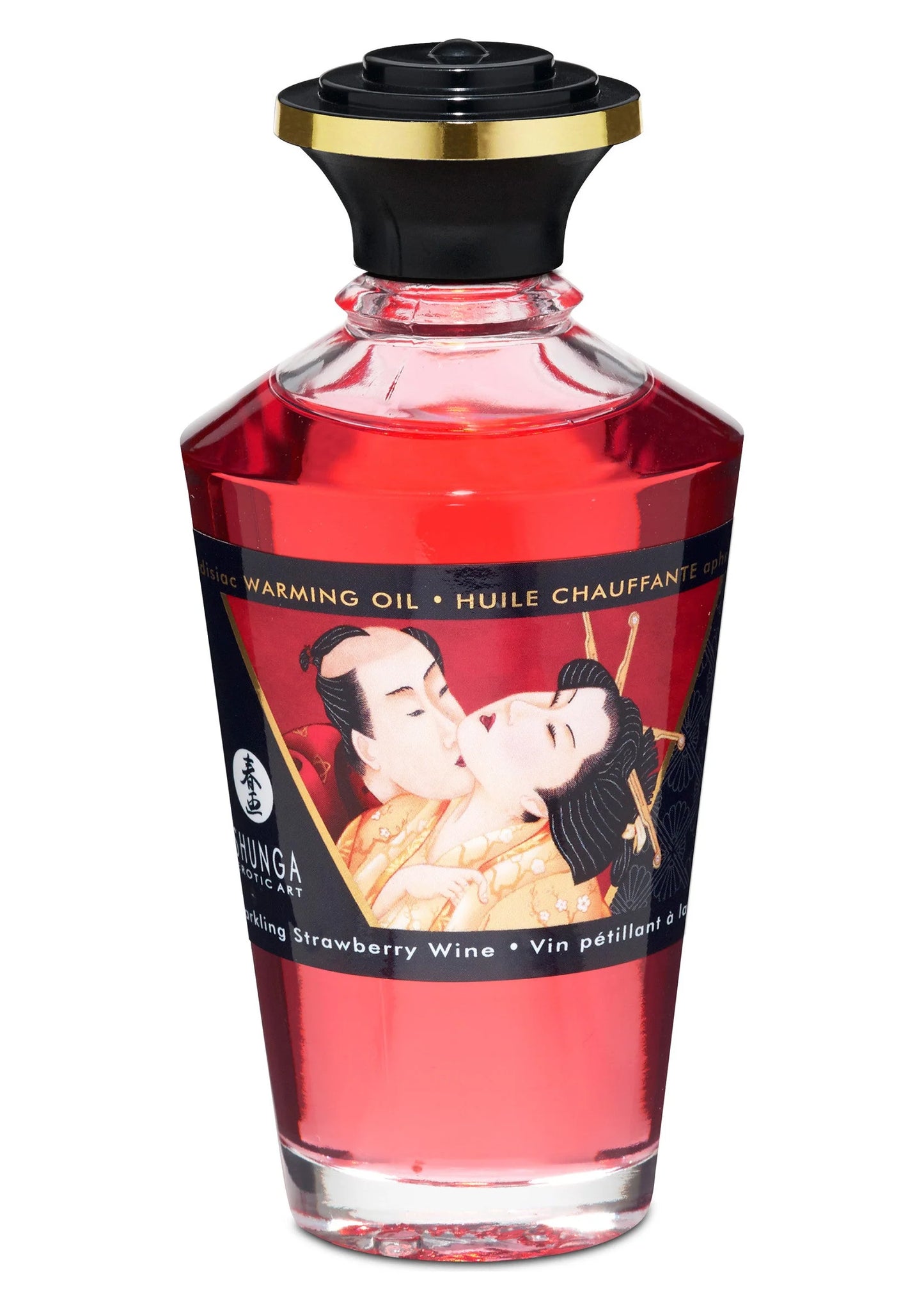 Opwarmende olie in rode glazen fles met zwarte dop