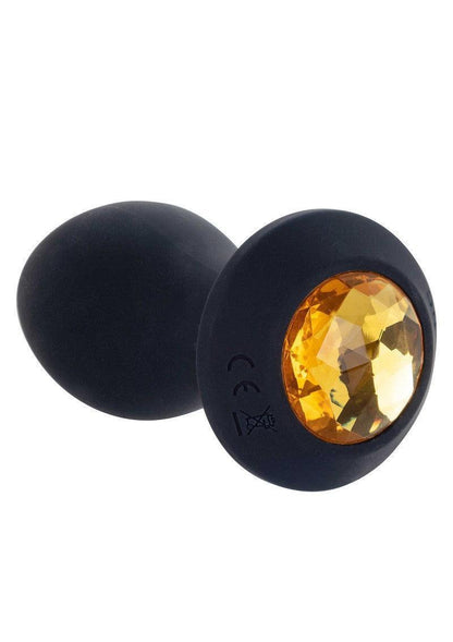 Zwarte vibrerende kontplug met amberkleurige ovale steen aan de voorzijde