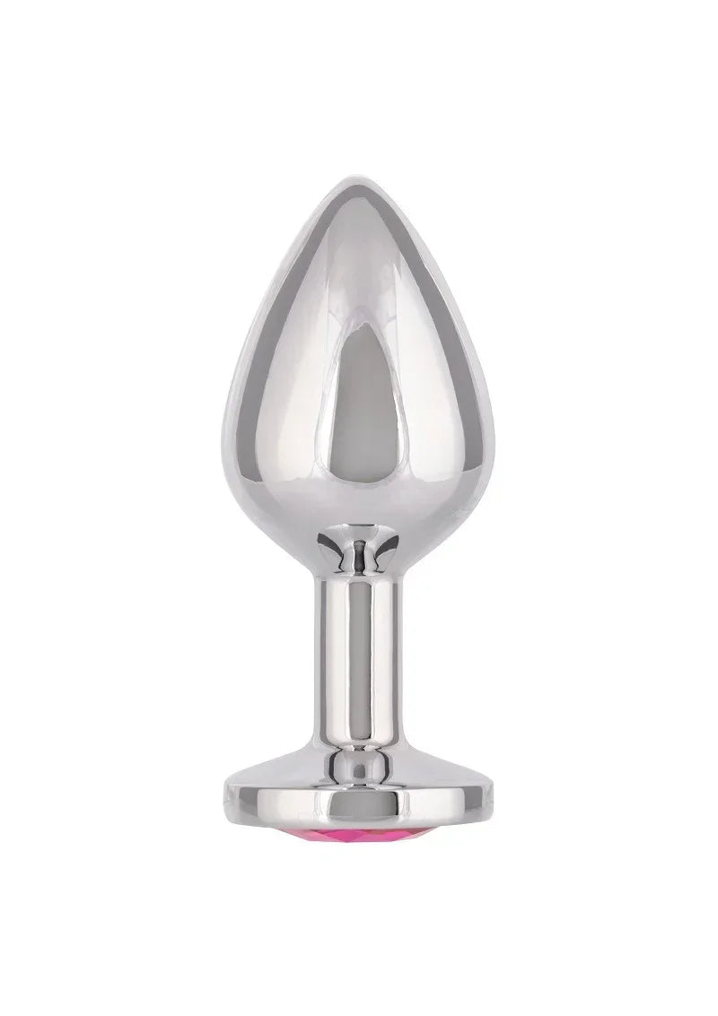 Metalen anale plug met druppelvormige flens en kleine roze steen onderaan.
